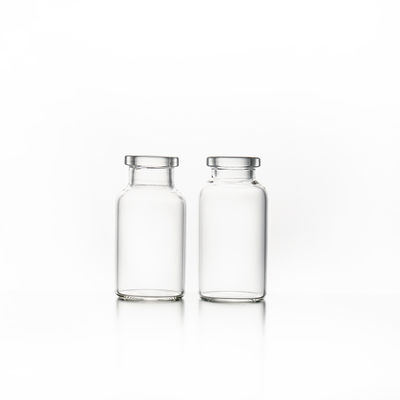 Los frascos de cristal farmacéuticos transparentes con la dirección helada de la superficie embalaron en caja del cartón